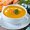 carrot-soup-with-cream-parsley-wooden-table-close-up