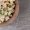 tasty-macaroni-with-mixed-salad-wooden-bowl_114579-83212