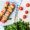 top-view-chicken-skewers-parchment-paper-with-cherry-tomatoes