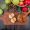 top-view-half-cut-apple-cutting-board-with-apple-juice-basket-apples-pinecone-leaves-wooden-table